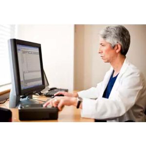 Image of a clinician looking at the Data messenger software on a computer