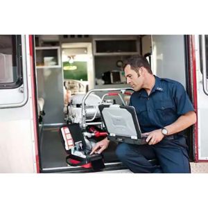 Image of a first responder checking on a computer the data messenger software 